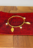 Gold plated adjustable bracelet with pearls. Handcrafted statement jewellery.