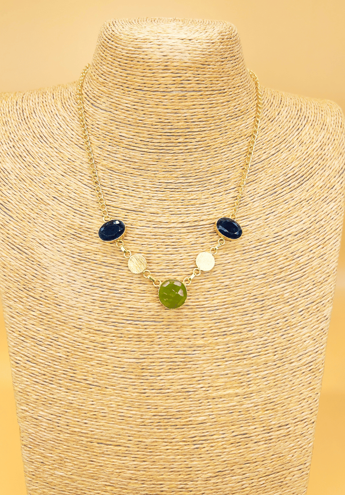 Gold plated necklace featuring light green and blue semi precious stones. Handcrafted statement jewellery.