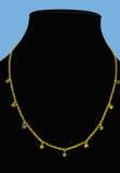 Gold plated necklace featuring multicolored diamond type cut stones. Handcrafted statement jewellery