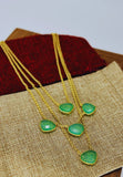 Gold plated necklace featuring glass stone. Handcrafted statement jewellery.