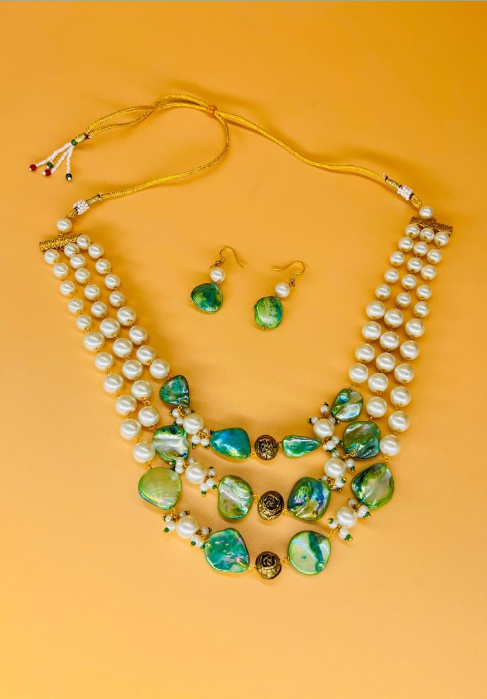Gold plated necklace featuring pearls and MOP stones. Handcrafted statement jewellery.
