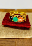 Gold plated adjustable bangle with raw stones. Handcrafted statement jewellery.