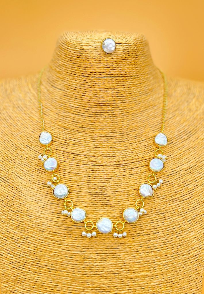 Gold plated necklace featuring pearls. Handcrafted statement jewellery.