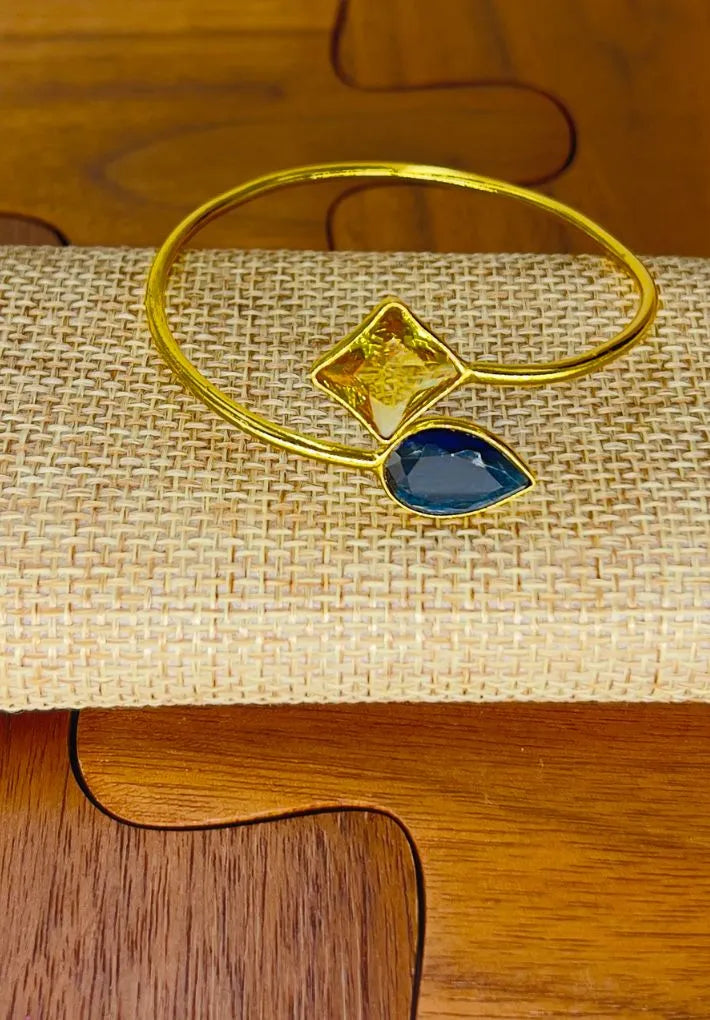 Gold plated adjustable bangle with multicolored glass stones. Handcrafted statement jewellery.