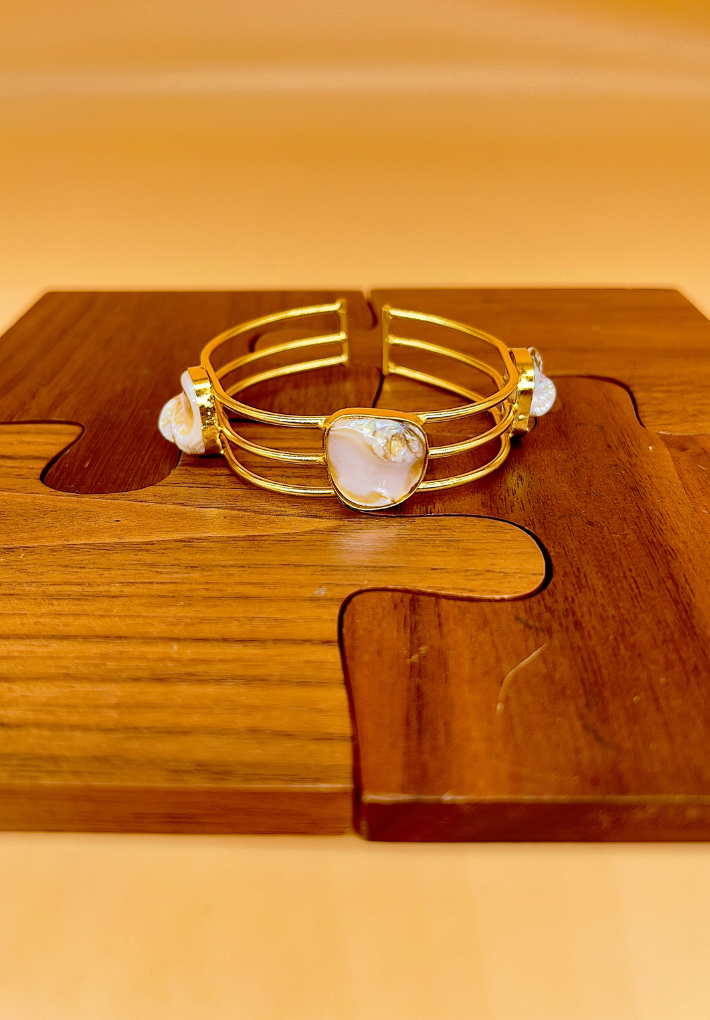 Gold plated adjustable bangle with MOP stones. Handcrafted statement jewellery.