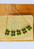 Gold plated necklace featuring multicolored raw stones. Handcrafted statement jewellery.
