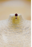 Gold plated earrings with Maroon semi precious stones stud. Contemporary design hand crafted jewellery