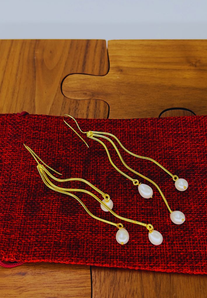 Gold plated earrings with pearls. Handcrafted statement jewellery.