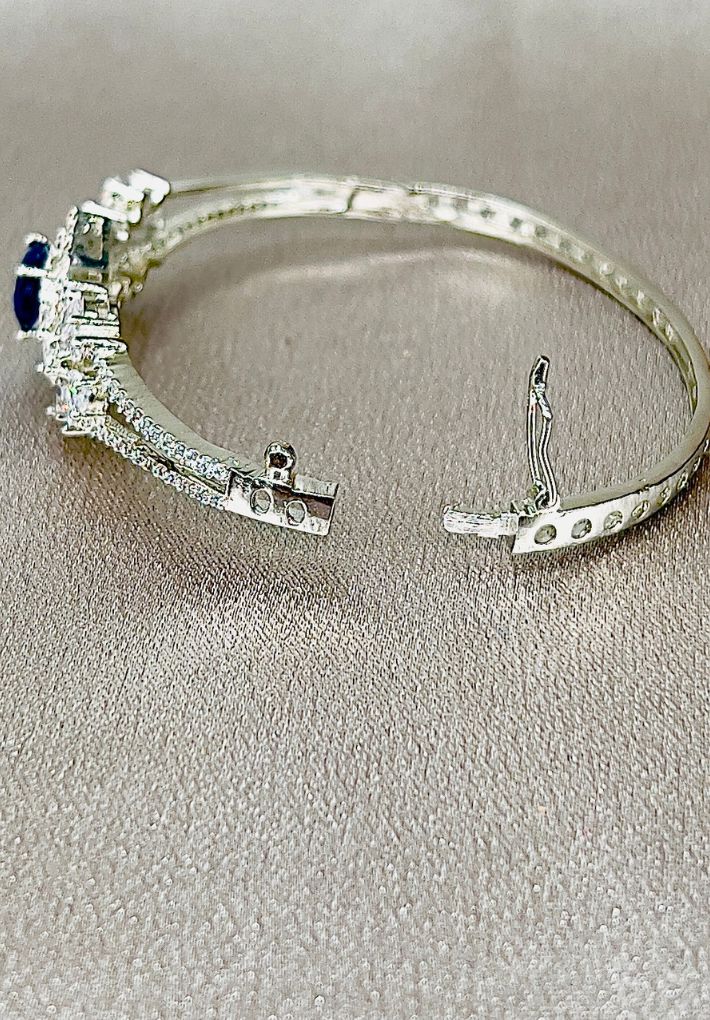 Snap fit bangle featuring American diamonds and hydro stones.
