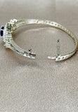 Snap fit bangle featuring American diamonds.