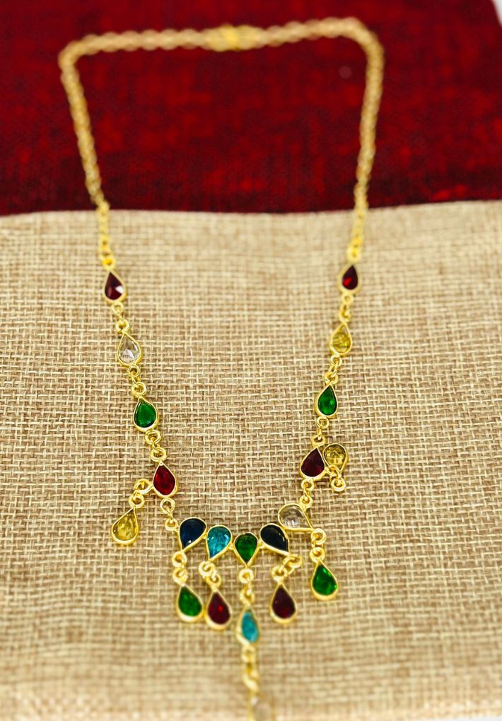 Gold plated necklace and earring set featuring multi colored glass stones. Handcrafted statement jewellery.