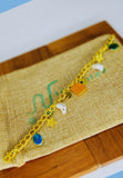 Gold plated adjustable bracelet with multi color stones. Handcrafted statement jewellery.