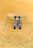 Dual tone American diamond studded necklace with green monalisa stone and matching earing