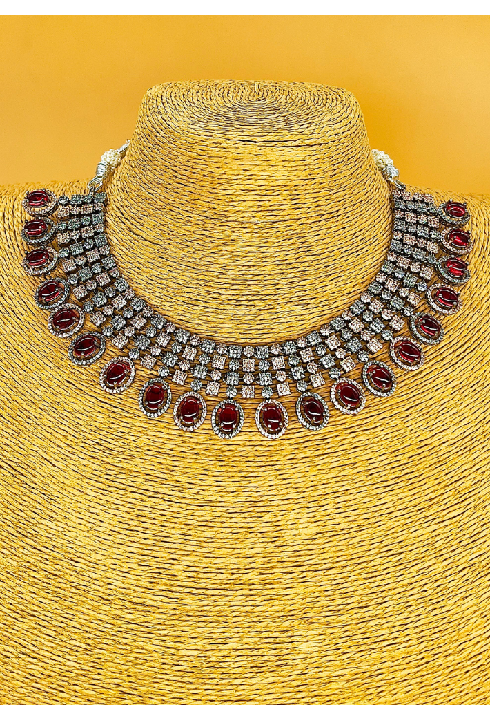 Dual tone American diamond studded necklace with ruby red monalisa stone and matching earing