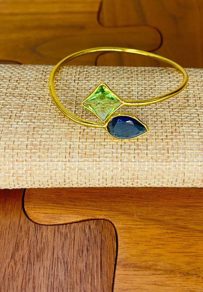 Gold plated adjustable bangle with multicolored glass stones. Handcrafted statement jewellery.