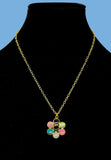 Gold plated necklace featuring multicolored stones. Handcrafted statement jewellery.