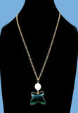 Gold plated necklace featuring green butterfly stones. Handcrafted statement jewellery.