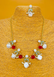 Gold plated necklace and earring set featuring monalisa stones and pearls. Handcrafted statement jewellery.
