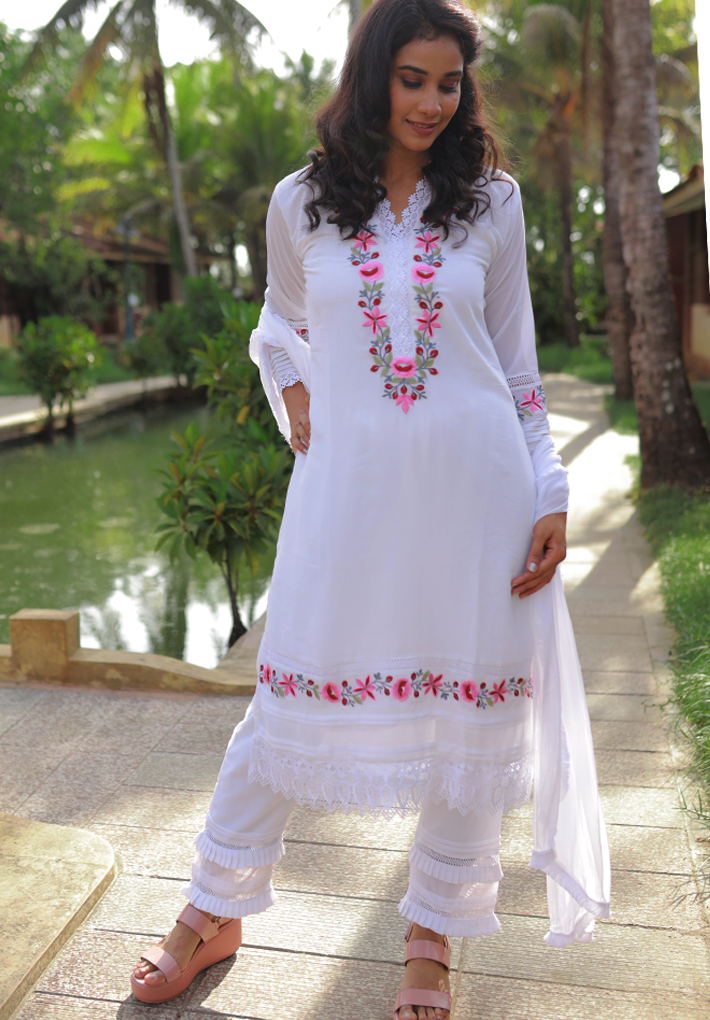 3 Piece Pakistani Salwar - White pakistani salwar with beautiful pink floral embroidery and elegant crochet works .White dupatta and matching pants with thread works. V Neck. Full sleeve. Straight hemline