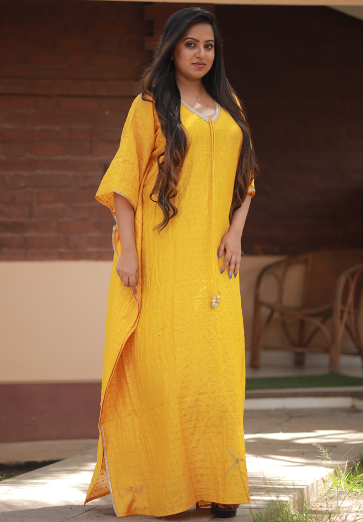 Beautiful yellow kaftan in muslin cotton with  mild crochet work and thread detail