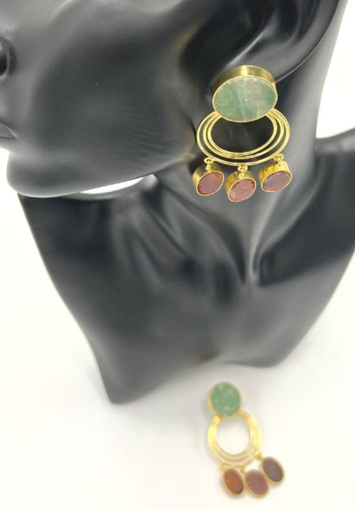 Beautiful gold plated earring set featuring red and green raw stones. Handcrafted statement jewellery.