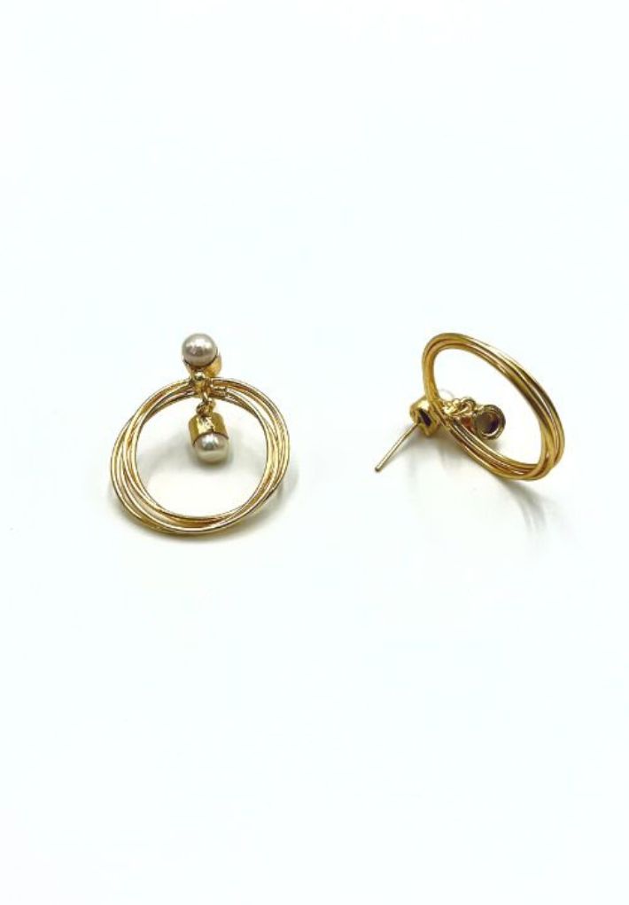 Beautiful gold plated earring set featuring natural pearl. Handcrafted statement jewellery.