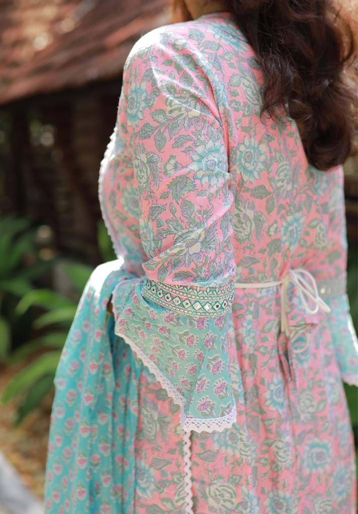3 Piece Salwar - Pink and blue salwar with floral prints, mirror work, belt detail and elegant crochet work .Matching design ondupatta and pants.Round neck. 3/4th sleeve.Flared hemline