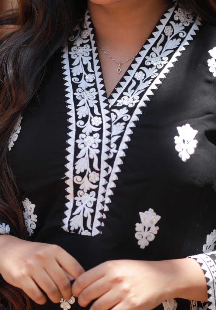 3 Piece Pakistani Salwar - Black pakistani salwar with beautiful white embroidery.Green printed dupatta and matching pantswith ikkat prints. V Neck. 3/4th loose sleeve. Straight hemline