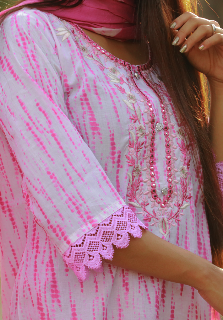 3 Piece Salwar - White salwar with pink prints, mirror work and elegant crochet work .Pink printed dupatta and matching pants. Round neck. 3/4th sleeve. Straight hemline