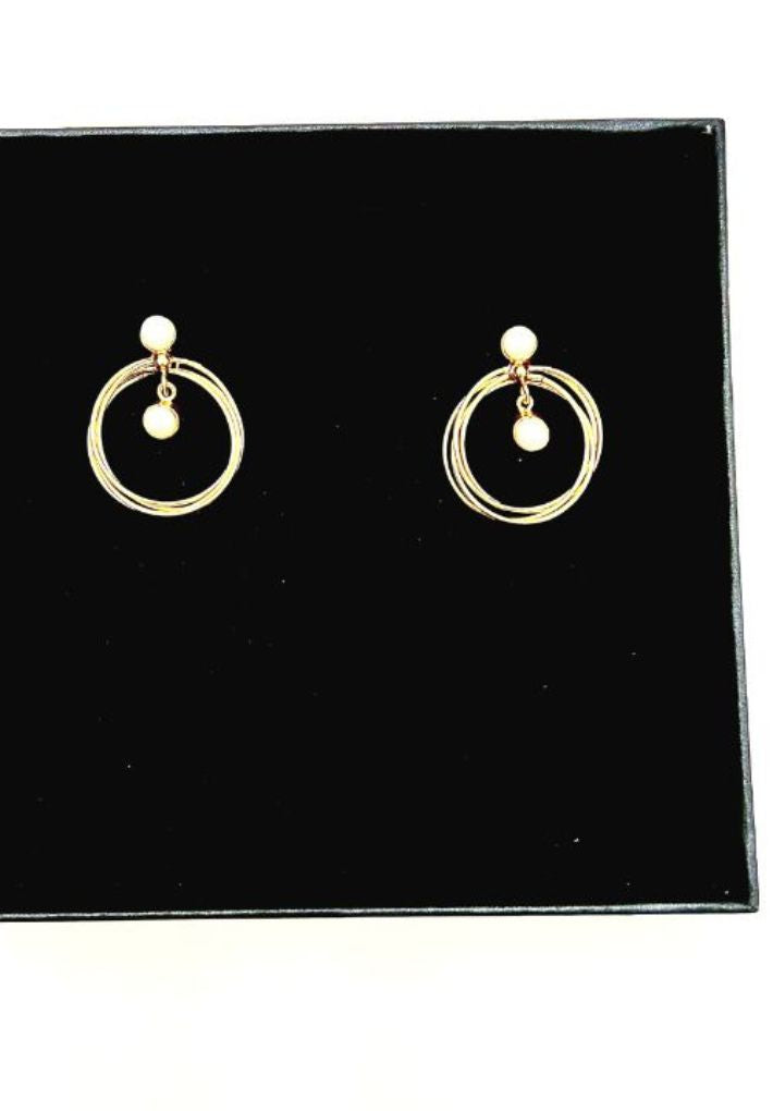 Beautiful gold plated earring set featuring natural pearl. Handcrafted statement jewellery.