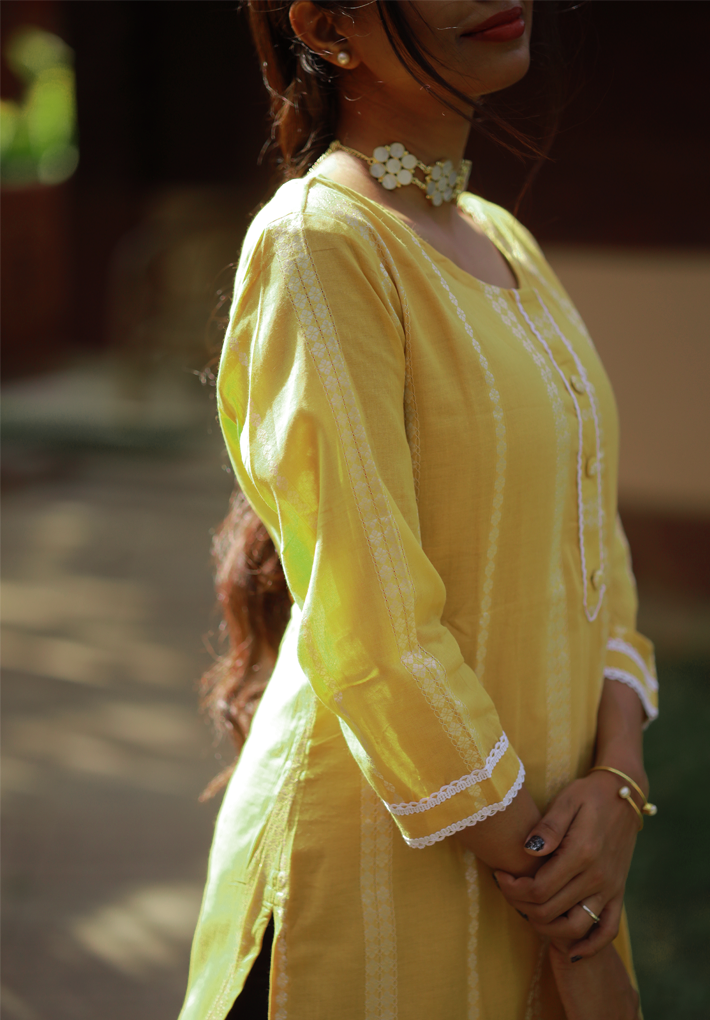 Kurti -Yellow kurti with white vertical design print and mild crochet works. 3/4th sleeve. Straight hemline.