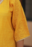 Beautiful yellow kaftan in muslin cotton with  mild crochet work and thread detail