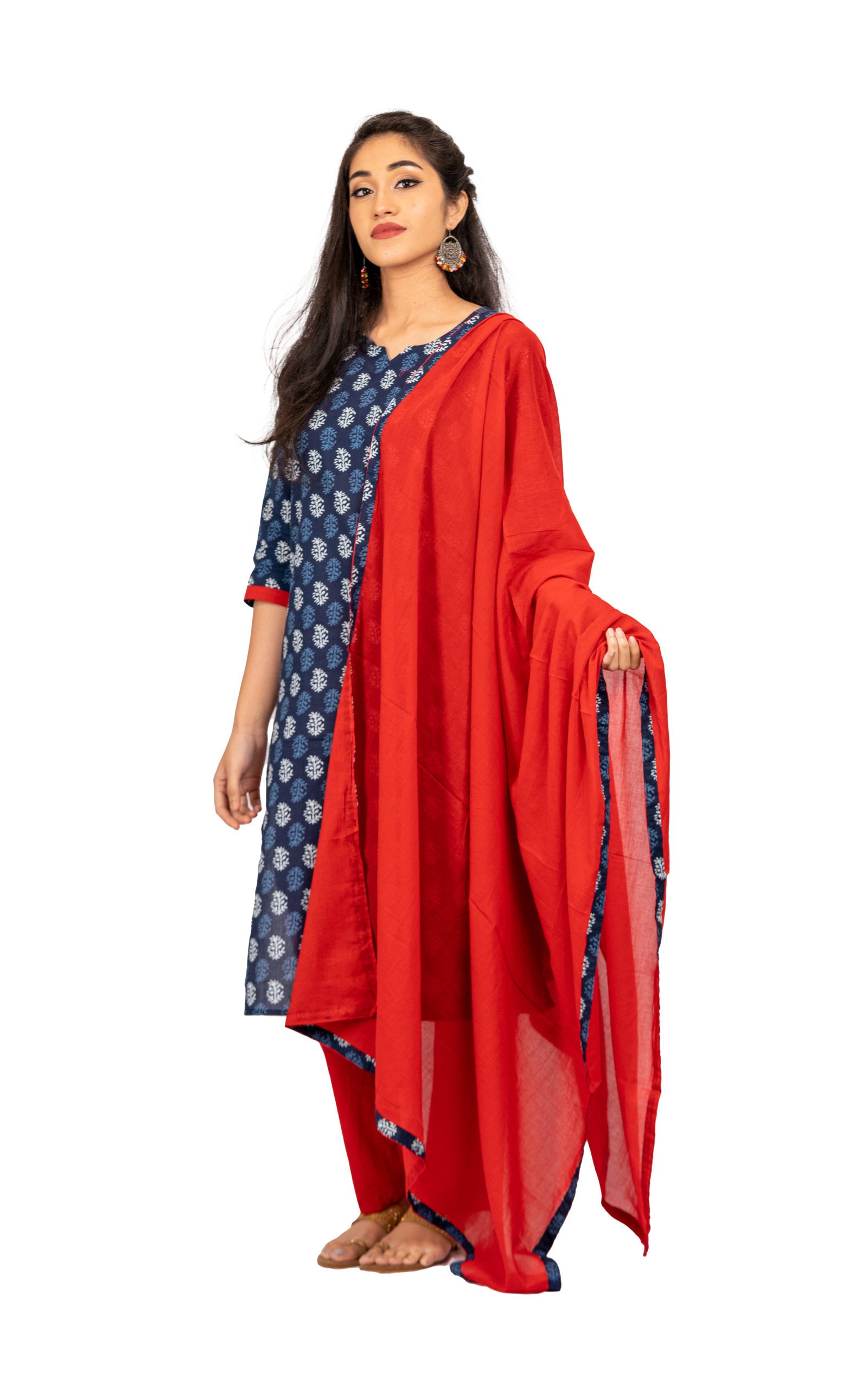 3 Piece Salwar - 100% Cotton indigo blue salwar with white and blue prints. Plain red 2 metre long dupatta with edge design matching the salwar fabric. Plain red pants matching the dupatta.