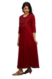 Full Gown - Red full gown with rich embroidery and mirror work in the front and gather detail. 3/4th Sleeve with matching embroidery at the tip. Round neck. Flared hemline deriving from the gather detail with matching embroidery. Rayon material.